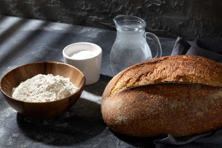 bread, wheat flour, salt and water in glass jug