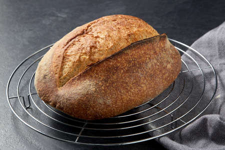 homemade craft bread on stand on table