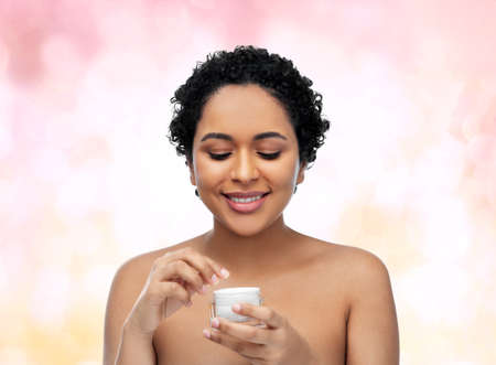 young african american woman with moisturizerの写真素材
