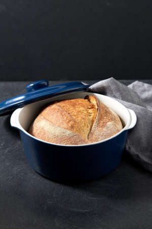 homemade craft bread in ceramic baking dishの写真素材