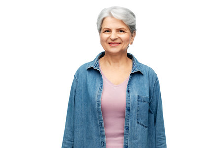 portrait of smiling senior woman in denim shirt