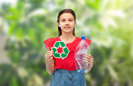 girl with green recycling sign and plastic bottleの写真素材