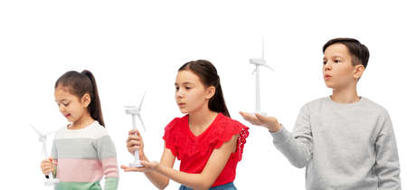 smiling children with toy wind turbine
