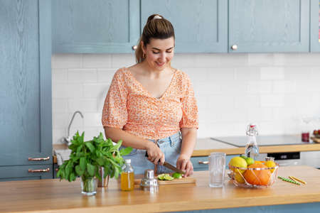 woman making cocktail drinks at home kitchen