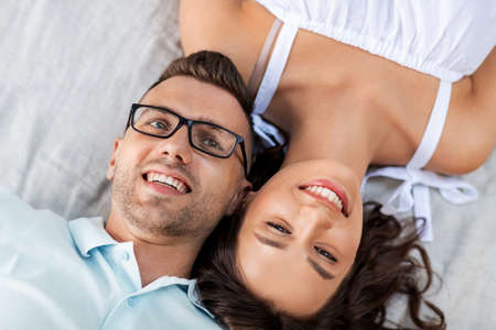 happy couple on picnic blanket