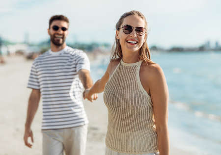 happy couple on summer beachの写真素材
