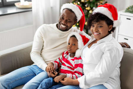 happy african american family on christmas at homeの写真素材