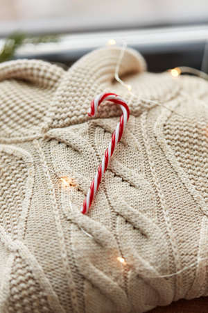 close up of sweater, candy cane, christmas garlandの写真素材
