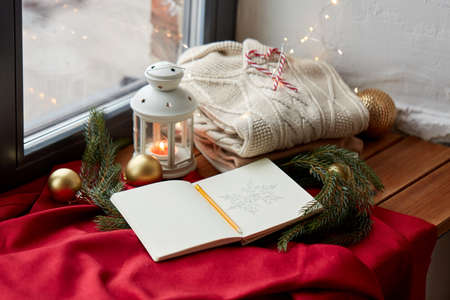 sketchbook, christmas lantern, sweater, fir branchの写真素材