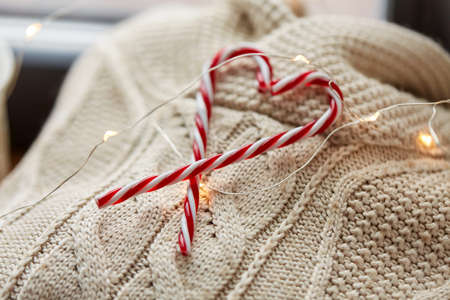 close up of sweater, candy cane, christmas garlandの写真素材