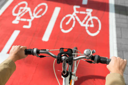 close up of bicycles wheel on bike lane in city