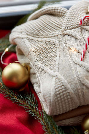 close up of sweater, candy cane, christmas garlandの写真素材