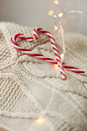 close up of sweater, candy cane, christmas garlandの写真素材