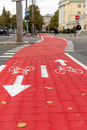 bike lane or red road with signs of bicyclesの写真素材