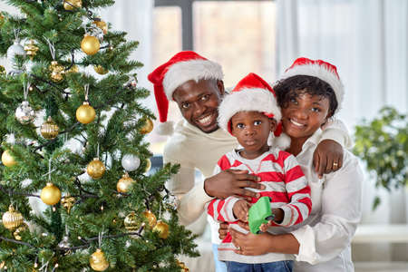 african family with toy cars at home on christmasの写真素材