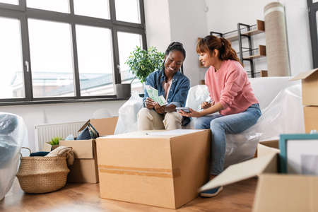 women moving to new home and counting money