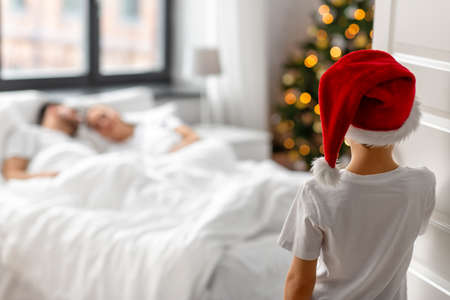 boy entering parents bedroom in christmas morningの写真素材