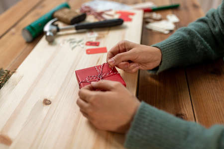 woman making advent calendar on christmas at homeの写真素材