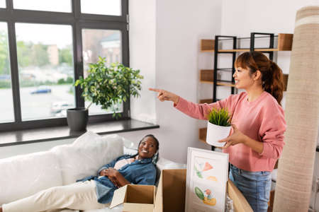 woman unpacking boxes and moving to new home