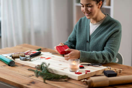 woman making advent calendar on christmas at homeの写真素材