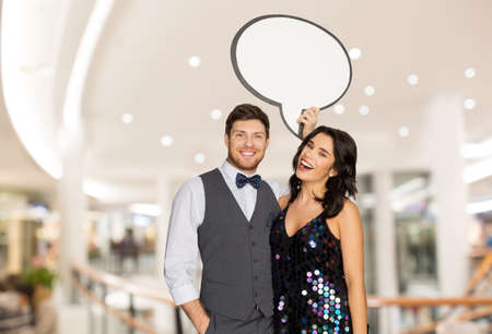 happy couple at party holding text bubble banner