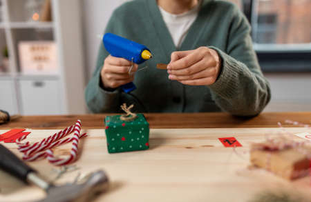 woman making advent calendar on christmas at homeの写真素材