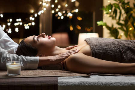 woman having face and head massage at spaの写真素材