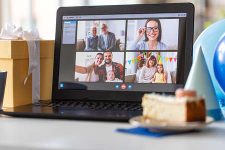 laptop with video call or online birthday partyの写真素材