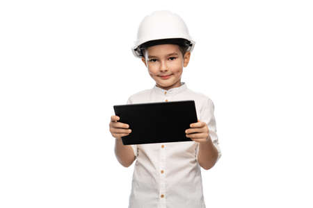 little boy in construction helmet with tablet pc
