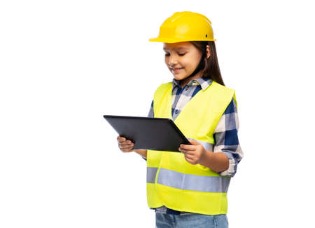 girl in helmet and safety vest with tablet pc