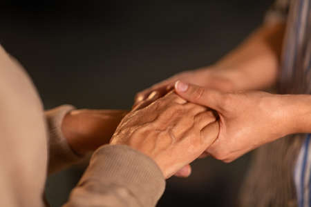 close up of women holding hands