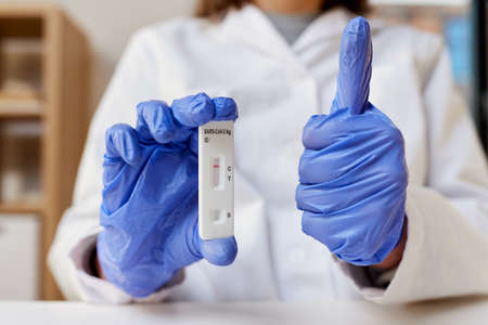 close up of doctor with negative coronavirus test