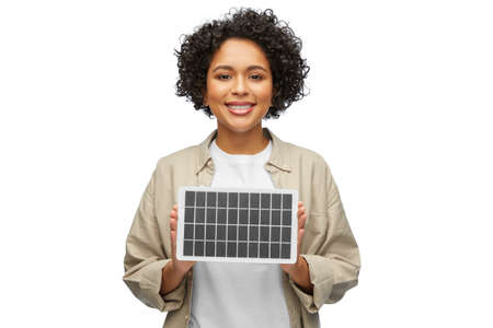 happy smiling woman with solar battery modelの写真素材