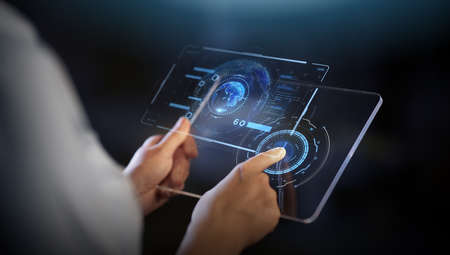 hands with transparent tablet pc and hologram