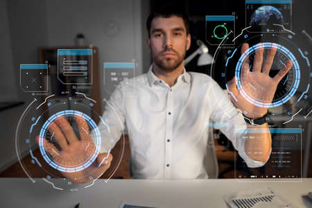 businessman with virtual projections on screen