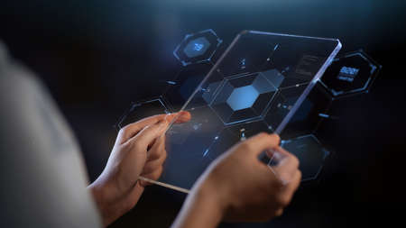hands with transparent tablet pc and hologram