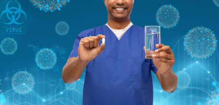 happy doctor or male nurse with medicine and waterの写真素材