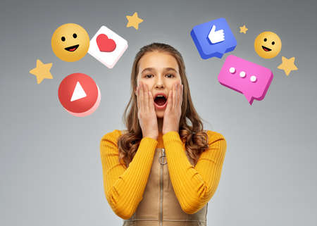 surprised or scared teenage girl over mobile icons