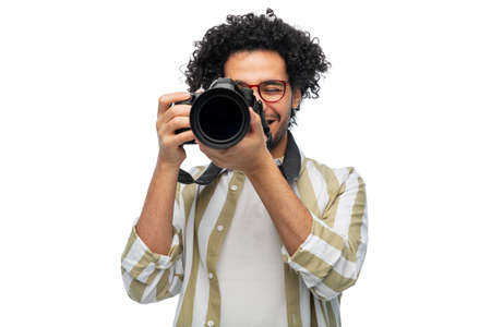 smiling man or photographer with digital cameraの写真素材