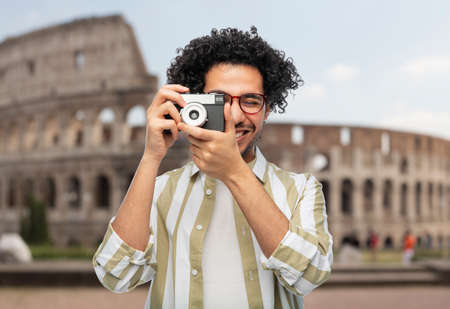 smiling man or photographer with camera in romeの写真素材