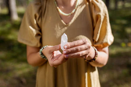 close up of woman holding magical crystalの写真素材
