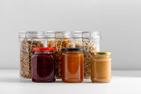 close up of preserves and cereals on tableの写真素材
