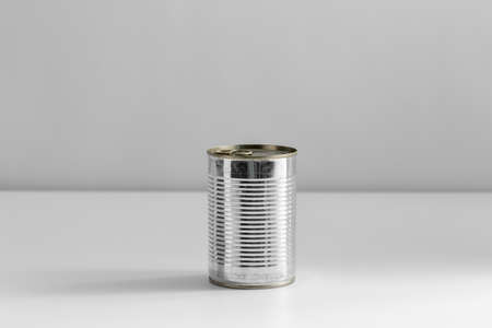 close up of tin can with preserved food on table
