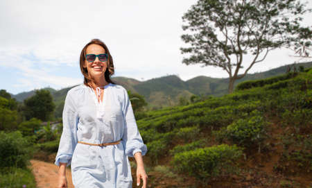 happy smiling woman walking at sri lanka
