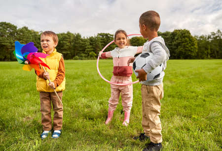 happy children with toys playing at parkの写真素材