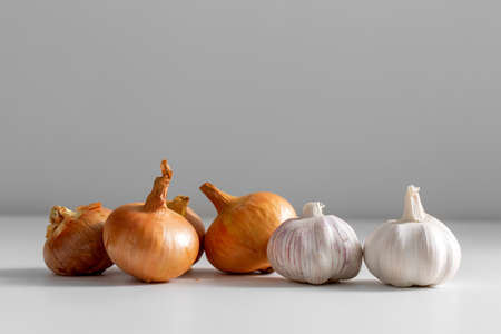 close up of onion and garlic on tableの写真素材