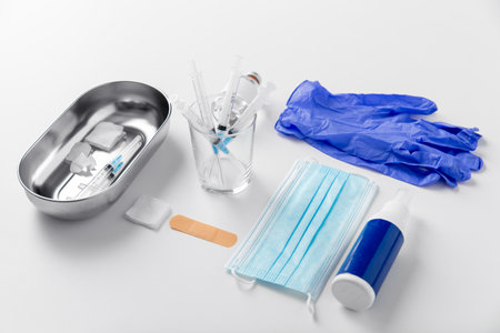 syringes, mask, gloves and other stuff on tableの写真素材