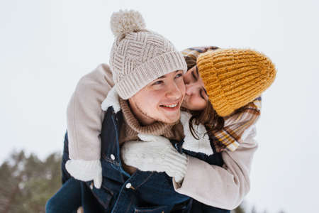 happy couple having fun in winter parkの写真素材