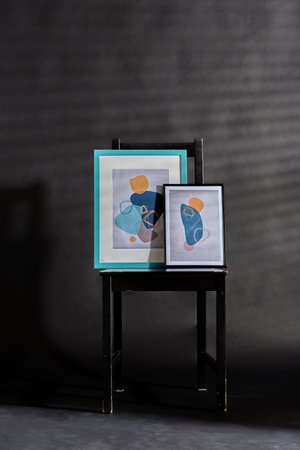 abstract pictures on chair over black background