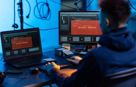 hacker using computer virus for cyber attackの写真素材